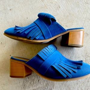 Blue heeled mules with fringe